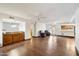 Open concept floor plan with wood floors connecting the kitchen and living room at 1213 W Esplanade St, Mesa, AZ 85201