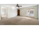 Main bedroom featuring an en-suite bath and a patio door leading outside at 1213 W Esplanade St, Mesa, AZ 85201