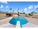 Relaxing pool scene surrounded by palm trees and mature landscaping with diving board at 1213 W Esplanade St, Mesa, AZ 85201