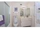 Bathroom featuring a tiled floor and a clean white vanity sink at 13423 W Countryside Dr, Sun City West, AZ 85375