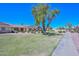 Community green space showing lots of green grass and well-maintained bushes at 13423 W Countryside Dr, Sun City West, AZ 85375