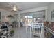 Bright dining area with sliding glass doors to the patio and light tile flooring at 13423 W Countryside Dr, Sun City West, AZ 85375