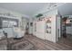 Cozy living room features wood flooring and built-in shelving for ample display space at 13423 W Countryside Dr, Sun City West, AZ 85375