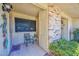 Inviting front porch with tiled floor, a chair, and charming decorations at 13423 W Countryside Dr, Sun City West, AZ 85375