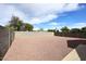 Spacious backyard is enclosed with a block fence at 13646 W Fargo Dr, Surprise, AZ 85374