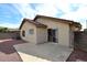 Backyard view featuring a large concrete patio area and stucco exterior, ideal for outdoor living at 13646 W Fargo Dr, Surprise, AZ 85374