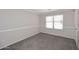 Bedroom with a window letting in bright natural light, plus chair rail and crown moulding at 13646 W Fargo Dr, Surprise, AZ 85374