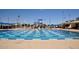 Community pool with multiple swimming lanes and water slide at 13646 W Fargo Dr, Surprise, AZ 85374