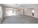 Spacious living room with carpet and lots of natural light at 13646 W Fargo Dr, Surprise, AZ 85374