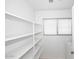 White pantry with ample shelving, providing generous storage space for food and supplies at 13646 W Fargo Dr, Surprise, AZ 85374