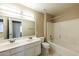 Full bathroom with double sinks, large vanity, and updated fixtures at 1406 W Charleston Ave, Phoenix, AZ 85023