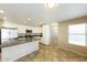 Well-equipped kitchen featuring white cabinets, a center island, and stainless steel appliances at 1406 W Charleston Ave, Phoenix, AZ 85023