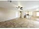 Well-lit living room offering tile flooring, an open floor plan, and effortless transition to the kitchen at 1406 W Charleston Ave, Phoenix, AZ 85023