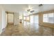 Bright and airy living room showcasing tile flooring, an open floor plan, and seamless access to the kitchen at 1406 W Charleston Ave, Phoenix, AZ 85023