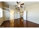 Spacious main bedroom features vaulted ceilings, a ceiling fan, hardwood floors, and ensuite access at 1406 W Charleston Ave, Phoenix, AZ 85023