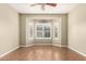 Bright, empty room with wood floors, a bay window, and neutral wall color at 14686 W Clarendon Ave, Goodyear, AZ 85395