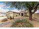 Charming single-story home featuring desert landscaping and a well-maintained exterior at 14686 W Clarendon Ave, Goodyear, AZ 85395