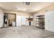 Spacious garage with storage cabinets, sink, and workbench, perfect for projects and organization at 14686 W Clarendon Ave, Goodyear, AZ 85395