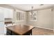 Eat-in kitchen nook featuring bright light, modern countertops, and island at 14686 W Clarendon Ave, Goodyear, AZ 85395