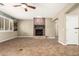 Inviting living room with a brick fireplace and a partial view into other rooms at 14686 W Clarendon Ave, Goodyear, AZ 85395