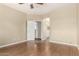 Primary bedroom featuring wood-look floors and an ensuite bath at 14686 W Clarendon Ave, Goodyear, AZ 85395