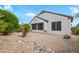 Charming backyard featuring rock landscaping and desert foliage at 15750 W Linksview Dr, Surprise, AZ 85374