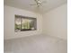 Bright bedroom with large window and neutral carpet, creating a serene space at 15750 W Linksview Dr, Surprise, AZ 85374