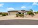 Inviting single-story home featuring desert landscaping and a two-car garage, perfect for low-maintenance living at 15750 W Linksview Dr, Surprise, AZ 85374