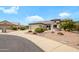 Well-kept home on a cul-de-sac, featuring a two-car garage, desert landscaping, and a welcoming facade at 15750 W Linksview Dr, Surprise, AZ 85374