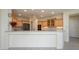 Well-lit kitchen featuring light wood cabinetry and granite countertops at 15750 W Linksview Dr, Surprise, AZ 85374