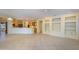 Spacious living room showcasing open floor plan and custom built-in shelving at 15750 W Linksview Dr, Surprise, AZ 85374