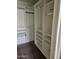 Large walk-in closet featuring metal clothing rods and built-in shelving for all your clothes at 1635 W Wisteria Dr, Chandler, AZ 85248