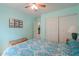 Cozy bedroom featuring a queen-size bed, closet, and soothing, light blue walls at 1814 N Parkside Ln, Casa Grande, AZ 85122