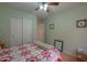 Relaxing bedroom with soft colors and hardwood floors features a closet and ensuite bathroom at 1814 N Parkside Ln, Casa Grande, AZ 85122