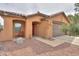 Cozy single-story house with charming desert landscaping, a covered entrance, and a two-car garage at 1814 N Parkside Ln, Casa Grande, AZ 85122