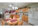 Functional kitchen featuring ample counter space, light wood cabinets, and a cozy dining area for casual meals at 1814 N Parkside Ln, Casa Grande, AZ 85122