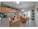 Bright kitchen with wood cabinetry, essential appliances, and a cozy breakfast nook perfect for everyday dining at 1814 N Parkside Ln, Casa Grande, AZ 85122