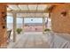 Covered patio overlooks a spacious backyard with decorative gravel and blue potted plants at 1814 N Parkside Ln, Casa Grande, AZ 85122