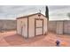 Outdoor storage shed in a low-maintenance backyard setting, and gravel landscaping at 1814 N Parkside Ln, Casa Grande, AZ 85122