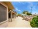 Desert backyard featuring a built in barbeque and water feature at 20562 N Bear Canyon Ct, Surprise, AZ 85387