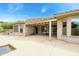 Rear covered patio provides shade to the backyard and pool at 20562 N Bear Canyon Ct, Surprise, AZ 85387