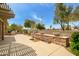 Beautifully landscaped backyard featuring a decorative stone water feature at 20562 N Bear Canyon Ct, Surprise, AZ 85387