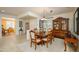 Elegant dining room with a chandelier, formal table setting, and seamless access to the living area at 20562 N Bear Canyon Ct, Surprise, AZ 85387