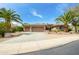 Charming home featuring a three-car garage and meticulously landscaped front yard with desert landscaping at 20562 N Bear Canyon Ct, Surprise, AZ 85387