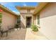 Cozy front porch area with tile flooring, comfortable seating, and covered entryway at 20562 N Bear Canyon Ct, Surprise, AZ 85387