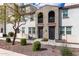 Contemporary townhome showcasing a well-manicured gravel yard and charming front entrances with modern accents at 2323 E Huntington Dr, Phoenix, AZ 85040