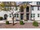 Contemporary townhome showcases a well-manicured gravel yard and charming front entrances with modern accents at 2323 E Huntington Dr, Phoenix, AZ 85040