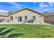 Spacious backyard featuring a grassy area, gravel landscaping, and an exterior home view at 3013 W Pollack St, Phoenix, AZ 85041