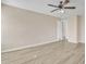 Relaxing bedroom featuring neutral walls, wood-look floors, and easy access to the bathroom at 3013 W Pollack St, Phoenix, AZ 85041