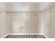 Walk-in closet with built-in shelving and wood-look flooring, ready for easy organization at 3013 W Pollack St, Phoenix, AZ 85041